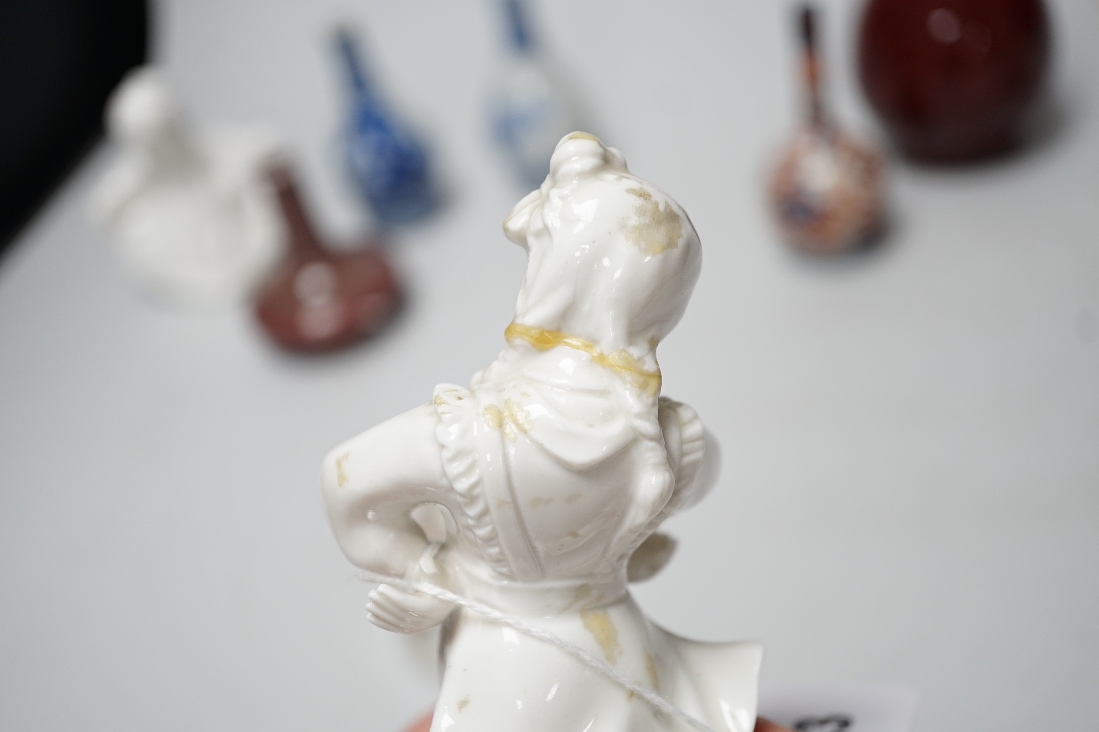 A Chinese sang de boeuf bottle neck vase, together with four Chinese miniature vases, three Chinese figures and a Chinese tea bowl, tallest 15cm